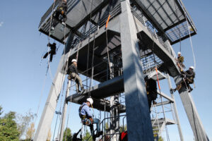 Industrial climber in a safety harness 